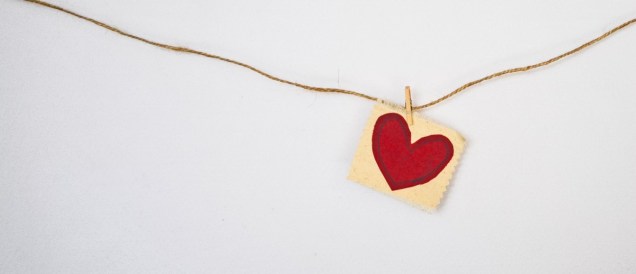 Red paper heart on a string